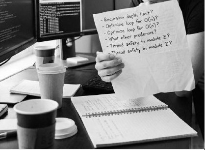 Engineer reviewing a list of technical questions